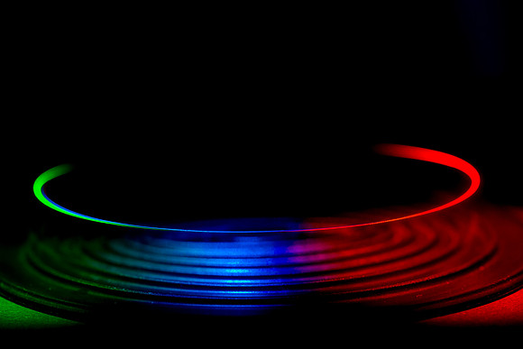Steel ball bearing spinning around a tray.